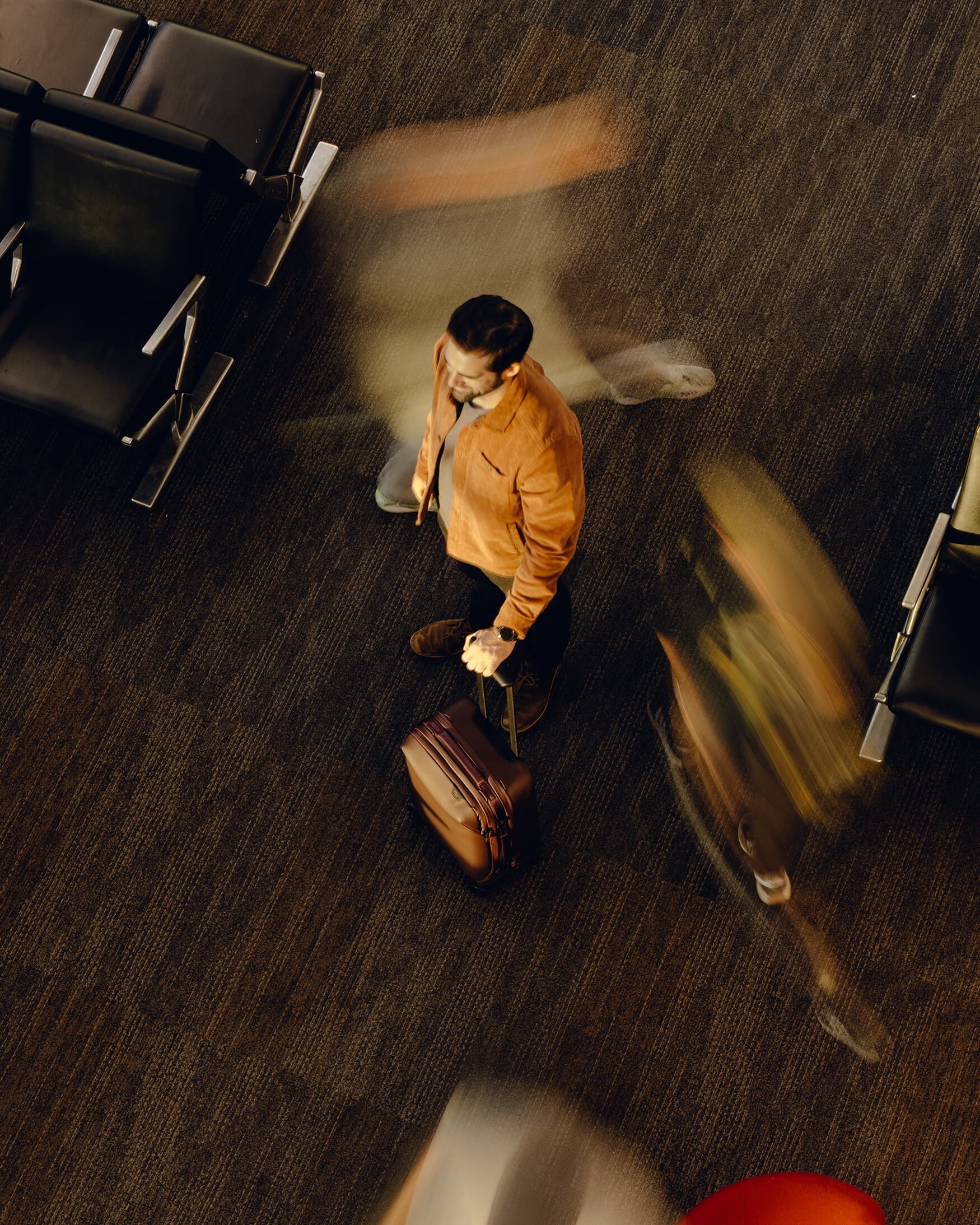 Man holding an Eclipse color Roller Bag
